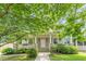 Charming home featuring a welcoming porch and mature trees in a picturesque setting at 3404 Orchard St, Hapeville, GA 30354