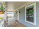 Inviting covered porch showcases wood flooring and stone accents at 3404 Orchard St, Hapeville, GA 30354