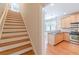 Staircase next to the kitchen with hardwood floors and stainless steel appliances at 3404 Orchard St, Hapeville, GA 30354