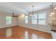 The spacious living area features hardwood floors, crown molding, and plenty of natural light at 3404 Orchard St, Hapeville, GA 30354