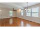 The spacious living area features hardwood floors, crown molding, and plenty of natural light at 3404 Orchard St, Hapeville, GA 30354