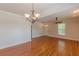 The spacious living area features hardwood floors, crown molding, and plenty of natural light at 3404 Orchard St, Hapeville, GA 30354