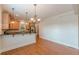 The spacious living area opens to the kitchen and features hardwood floors and natural light at 3404 Orchard St, Hapeville, GA 30354