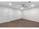 Bedroom features hardwood floors, a ceiling fan and a large closet with mirrored doors at 433 The North Chace, Atlanta, GA 30328