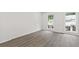 Bright bedroom with hardwood floors and large windows, offering ample natural light and backyard view at 433 The North Chace, Atlanta, GA 30328