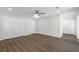 Spacious bedroom with wood-look floors, ceiling fan, recessed lights, and double closets at 433 The North Chace, Atlanta, GA 30328