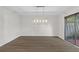 Open dining area features a stylish chandelier and wood flooring, ideal for hosting gatherings at 433 The North Chace, Atlanta, GA 30328