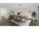 Elegant dining room with modern light fixture, stylish decor, and hardwood flooring at 433 The North Chace, Atlanta, GA 30328