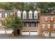 Charming brick townhome with manicured landscaping and multi-car garage in a desirable neighborhood at 433 The North Chace, Atlanta, GA 30328