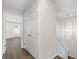 Bright hallway with doors and a staircase leading upstairs, providing seamless access to other areas of the home at 433 The North Chace, Atlanta, GA 30328