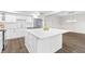 Modern kitchen with stainless steel appliances, white cabinetry, and a large center island at 433 The North Chace, Atlanta, GA 30328