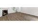 Spacious living room with fireplace, hardwood floors and access to the upper level at 433 The North Chace, Atlanta, GA 30328