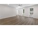 Spacious living room with hardwood floors and multiple windows, creating a bright and airy atmosphere at 433 The North Chace, Atlanta, GA 30328