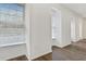Bright living room with wood floors and large windows with natural light at 433 The North Chace, Atlanta, GA 30328