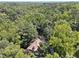 Aerial view of a private estate surrounded by mature trees at 1042 Bailey Rd, Woodstock, GA 30188