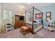 Bright bedroom with a four-poster bed, soft blue walls, and ample natural light at 1042 Bailey Rd, Woodstock, GA 30188