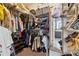 Walk-in closet with shelves and racks for optimal storage organization at 1042 Bailey Rd, Woodstock, GA 30188
