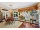 Elegant dining room featuring a chandelier, hard wood floors, and natural light at 1042 Bailey Rd, Woodstock, GA 30188