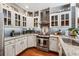 Modern kitchen with granite countertops, stainless steel appliances, and stylish backsplash at 1042 Bailey Rd, Woodstock, GA 30188
