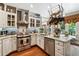 Bright kitchen with granite countertops, stainless steel appliances, and a view to the outside at 1042 Bailey Rd, Woodstock, GA 30188