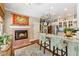 Cozy kitchen with a fireplace, granite countertops, a pot rack, and stainless steel appliances at 1042 Bailey Rd, Woodstock, GA 30188