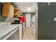 Long laundry room with tile floor, white cabinets, granite countertop, and white washer and dryer set at 1042 Bailey Rd, Woodstock, GA 30188