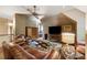 Comfortable living room with leather furniture, ceiling fan and large TV at 1042 Bailey Rd, Woodstock, GA 30188