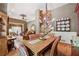 Open-concept living and dining area, showcasing elegant decor and abundant natural light at 1042 Bailey Rd, Woodstock, GA 30188