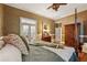 Relaxing main bedroom with hardwood floors and access to an outdoor balcony at 1042 Bailey Rd, Woodstock, GA 30188
