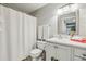 Well-maintained bathroom features a shower with white curtain, white cabinets and contemporary fixtures at 3650 Ashford Dunwoody Ne Rd # 1024, Atlanta, GA 30319