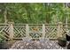 Charming outdoor deck with wooded views, seating, and dining space, perfect for relaxation at 3650 Ashford Dunwoody Ne Rd # 1024, Atlanta, GA 30319