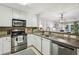 Well-lit kitchen features stainless steel appliances and a breakfast bar at 3650 Ashford Dunwoody Ne Rd # 1024, Atlanta, GA 30319