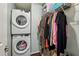 Functional walk-in closet with stacked washer and dryer, and ample shelving for storage at 3650 Ashford Dunwoody Ne Rd # 1024, Atlanta, GA 30319