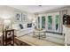 Bright living room boasts a cozy white sofa with blue accents and a view of the outdoor balcony at 3650 Ashford Dunwoody Ne Rd # 1024, Atlanta, GA 30319