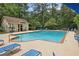Community outdoor pool with lounge chairs and nearby building, perfect for hot summer days at 3650 Ashford Dunwoody Ne Rd # 1024, Atlanta, GA 30319