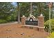 Welcome to The Park at Ashford Condominium sign surrounded by lush greenery at 3650 Ashford Dunwoody Ne Rd # 1024, Atlanta, GA 30319