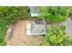 An aerial view of a charming blue and white home with a new roof and wooden deck at 106 Adair Ave, Atlanta, GA 30315