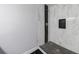 Custom tiled walk-in shower with black and white tiles and a storage niche at 106 Adair Ave, Atlanta, GA 30315