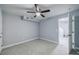 A bedroom with ceiling fan and a door leading to a staircase at 106 Adair Ave, Atlanta, GA 30315