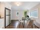 Bright kitchen featuring stainless steel refrigerator and a modern dining space at 106 Adair Ave, Atlanta, GA 30315