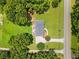 Aerial view of the home showcasing its expansive lot, driveway, and proximity to surrounding greenery at 1400 Land Rd, Canton, GA 30114