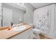 Well-lit bathroom with a shower-tub combo, neutral walls, and ample vanity space at 1400 Land Rd, Canton, GA 30114