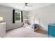 Bright bedroom with a house-frame bed, neutral walls, and a window offering natural light at 1400 Land Rd, Canton, GA 30114
