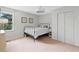 Inviting bedroom features neutral walls, a window bringing in natural light, and a comfortable bed at 1400 Land Rd, Canton, GA 30114