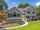 Charming home with gray siding, black shutters, and a cheerful yellow front door at 1400 Land Rd, Canton, GA 30114