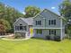 Beautiful gray two-story home with black shutters and a well-manicured lawn at 1400 Land Rd, Canton, GA 30114