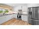 Modern kitchen design with stainless steel refrigerator and a contrasting countertop at 1400 Land Rd, Canton, GA 30114
