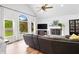 Bright living room featuring large windows and a cozy fireplace at 1400 Land Rd, Canton, GA 30114