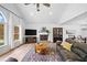Comfortable living room with vaulted ceiling, fireplace, and access to dining area at 1400 Land Rd, Canton, GA 30114