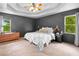 Primary bedroom features a trey ceiling, large windows, and ample space for relaxation at 1400 Land Rd, Canton, GA 30114